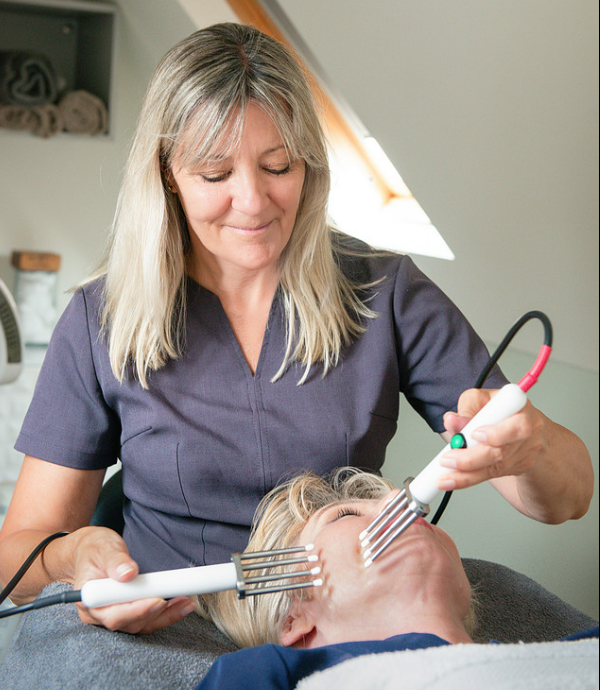 Julie Ward performing a CACI non-surgical face and neck lift treatment
